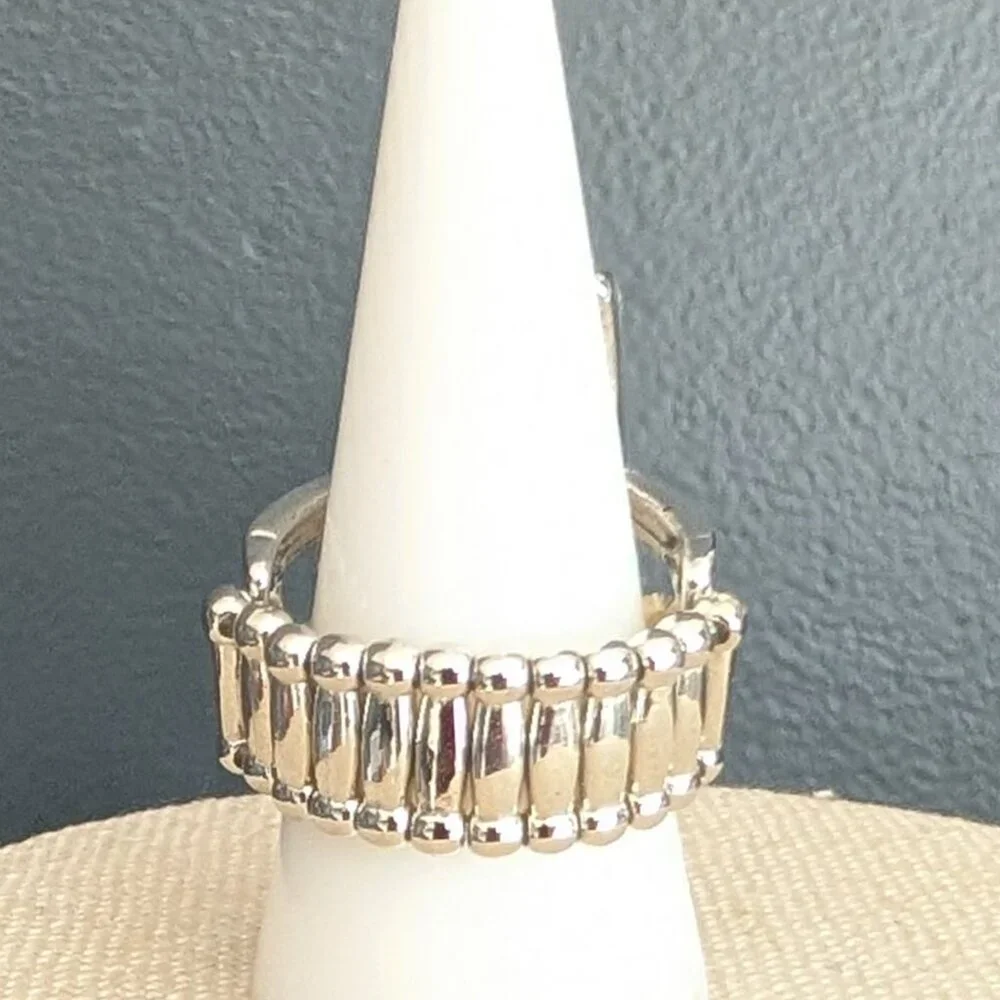 Orangey red glass ring with center bright blue stripe stretch ring